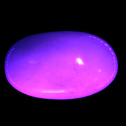 White Jade palm stone from Pakistan 62-72mm 63-86.7g in UV light