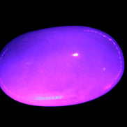 White Jade palm stone from Pakistan 62-72mm 63-86.7g in UV light