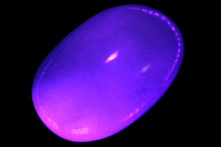 White Jade palm stone from Pakistan 62-72mm 63-86.7g in UV light