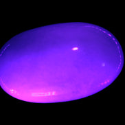 White Jade palm stone from Pakistan 62-72mm 63-86.7g in UV light