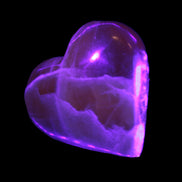 Honey Calcite heart 66-75g in UV light Rocks and Things
