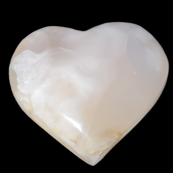 Mangano Calcite hand-carved heart 56*54*20mm 87.5g in sunlight - Rocks and Things Store