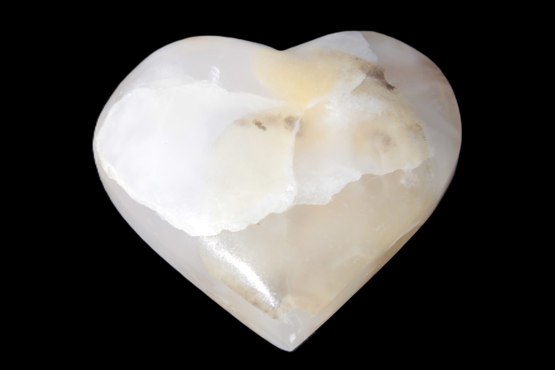 Mangano Calcite hand-carved heart 56*54*20mm 87.5g Rocks and Things