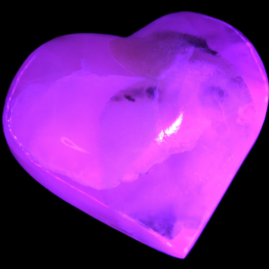 Mangano Calcite hand-carved heart 56*54*20mm 87.5g in UV light - Rocks and Things Store