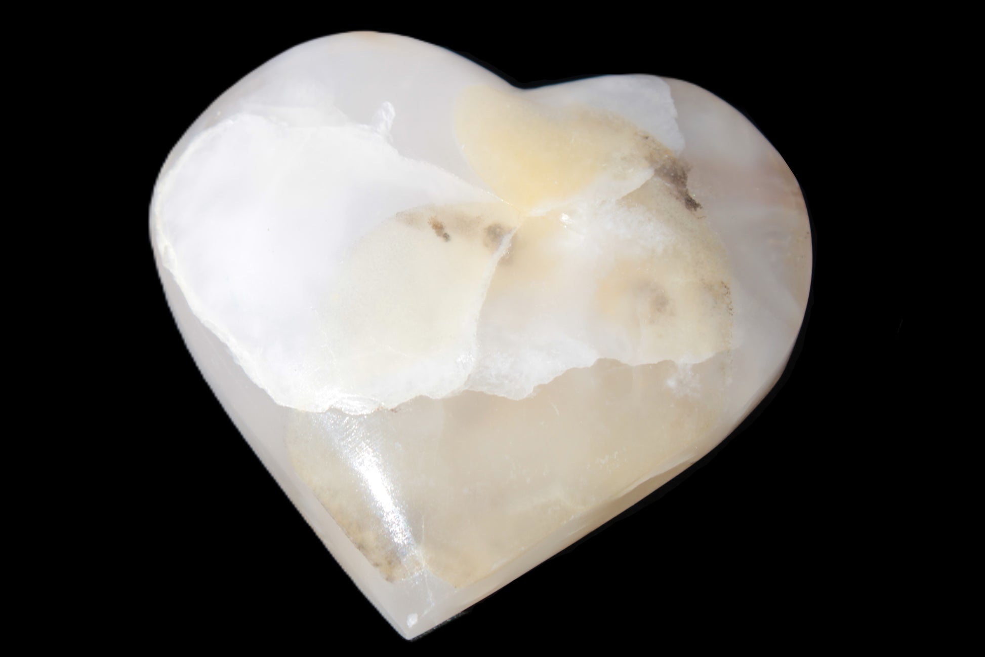 Mangano Calcite hand-carved heart 56*54*20mm 87.5g Rocks and Things