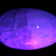 Pistachio Calcite palmstone 121-168g in  UV light
