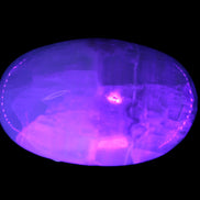 Pistachio Calcite palmstone 121-168g in  UV light