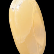 Honey Calcite palm stone 58-62mm 83-95g in sunshine - Rocks and Things Store