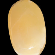 Honey Calcite palm stone 58-62mm 83-95g in sunshine - Rocks and Things Store