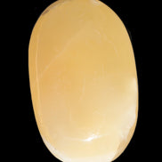 Honey Calcite palm stone 58-62mm 83-95g in sunshine - Rocks and Things Store