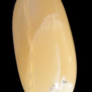 Honey Calcite palm stone 58-62mm 83-95g in sunshine - Rocks and Things Store