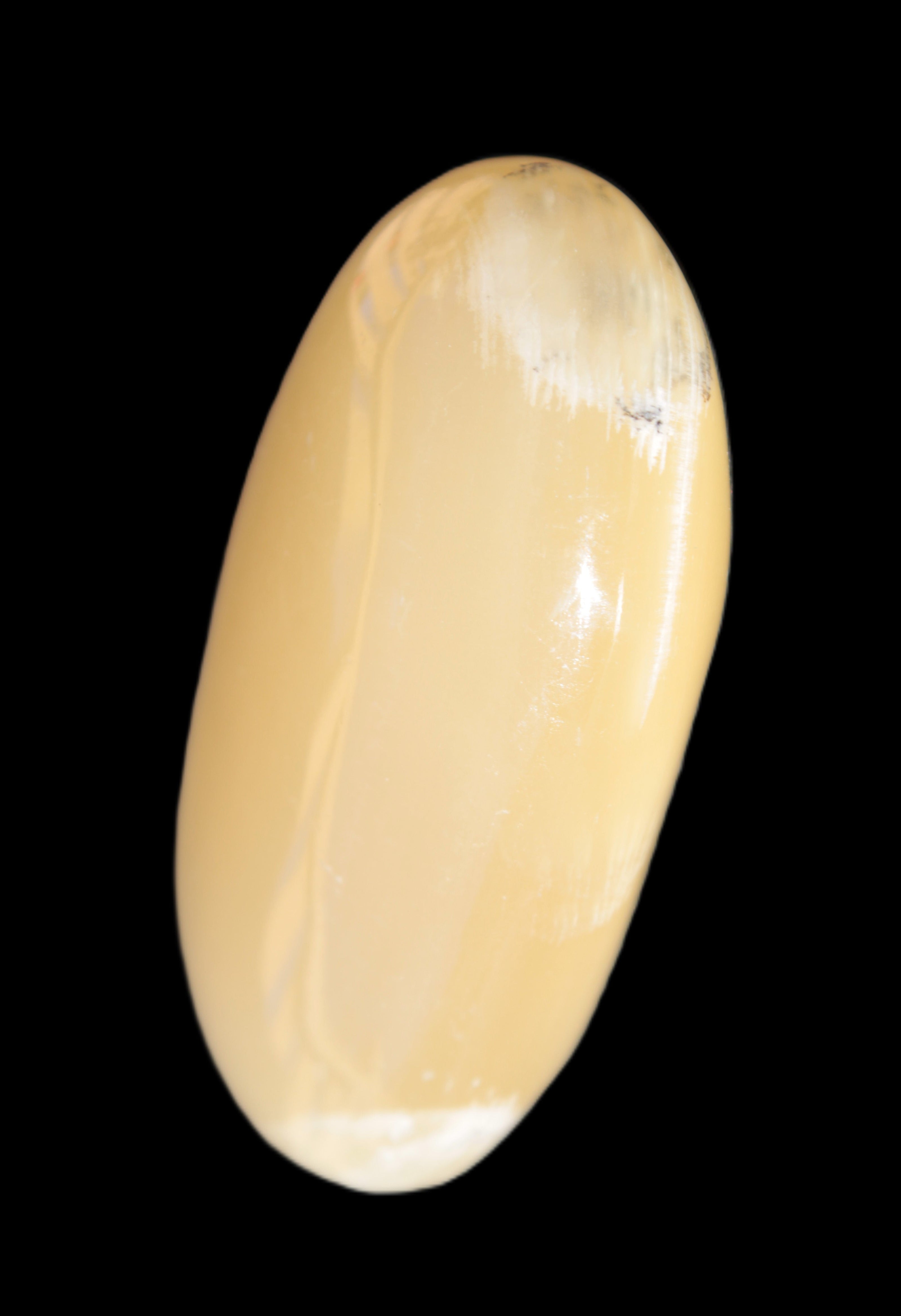 Honey Calcite palm stone 58-62mm 83-95g in sunshine - Rocks and Things Store