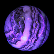 Beautiful Chocolate Calcite sphere 48mm 162g in UV light - Rocks and Things Store