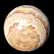 Beautiful Chocolate Calcite sphere 48mm 162g in sunlight - Rocks and Things Store