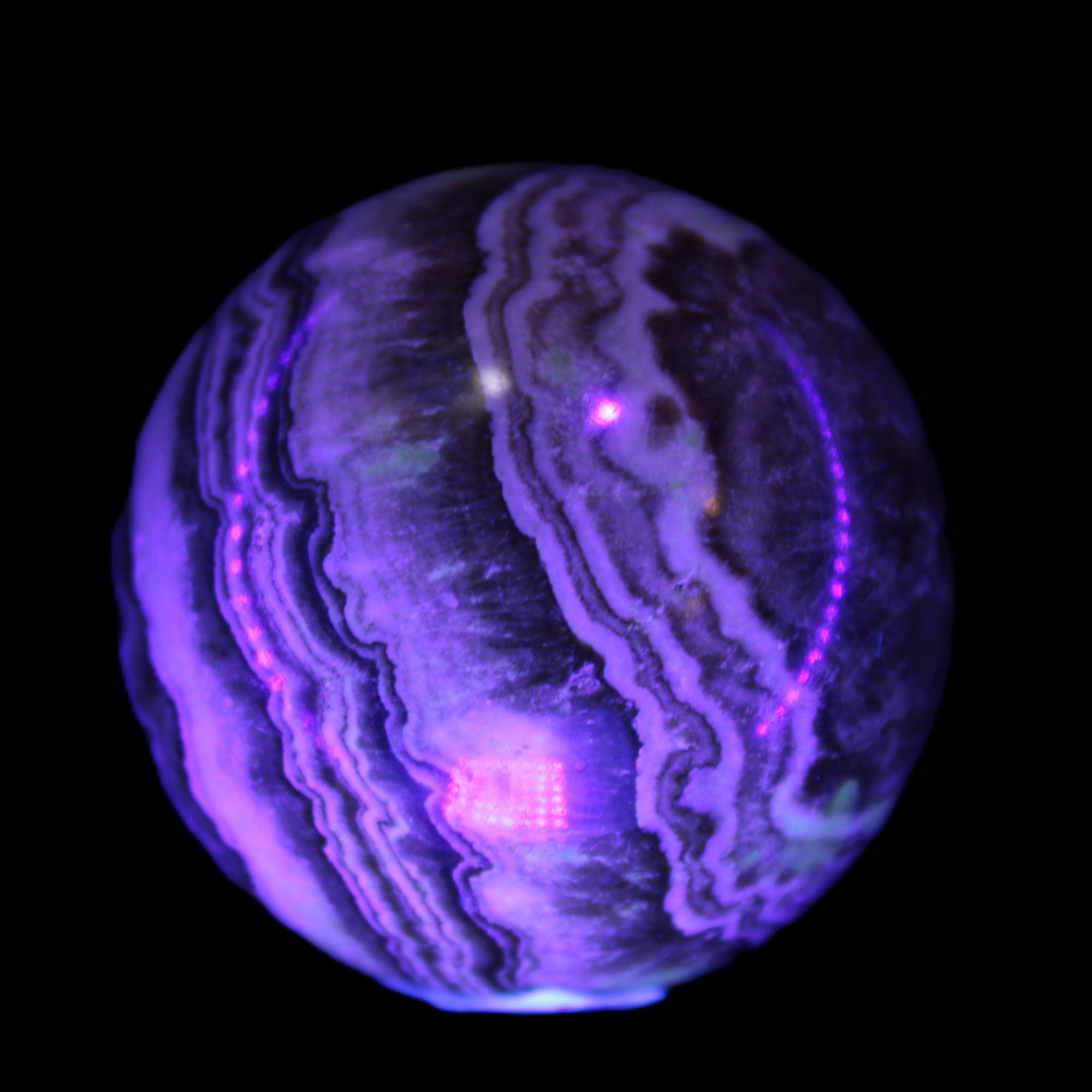 Beautiful Chocolate Calcite sphere 48mm 162g in UV light - Rocks and Things Store