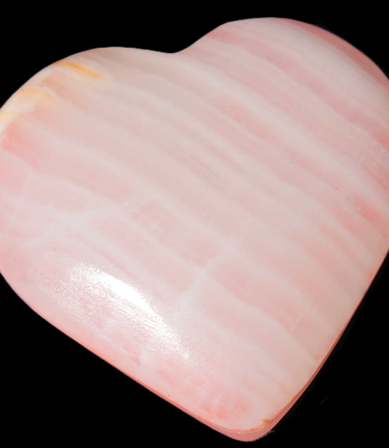 Calcite dyed hand-carved orange heart 71*70*20mm 135.9g in sunlight - Rocks and Things Store