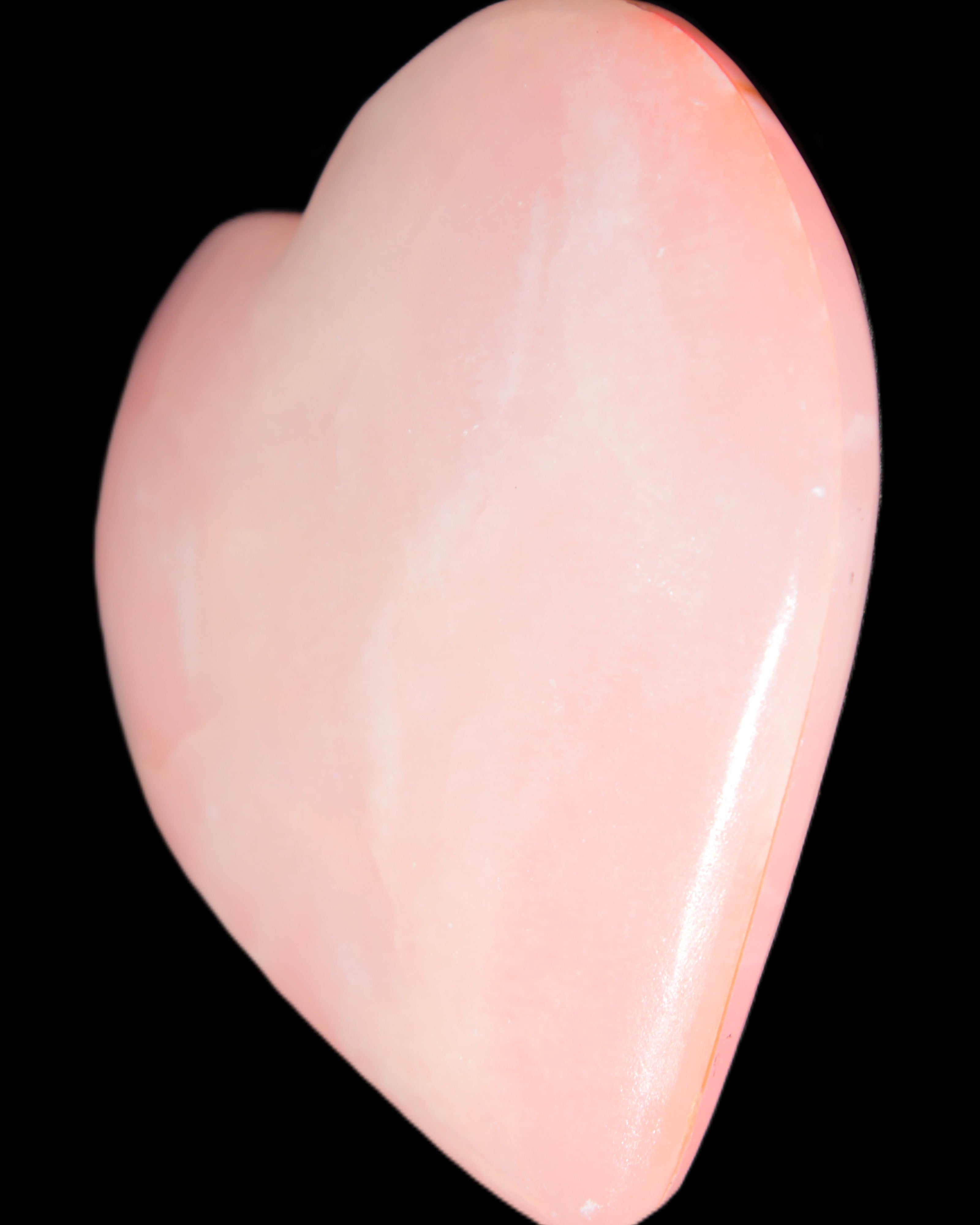 Calcite dyed hand-carved orange heart 71*70*20mm 135.9g in sunlight - Rocks and Things Store