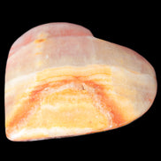 Calcite dyed hand-carved heart 61*58*16mm 85.5g in sunlight - Rocks and Things Store