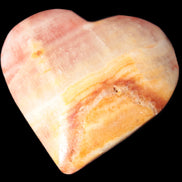 Calcite dyed hand-carved heart 61*58*16mm 85.5g in sunlight - Rocks and Things Store