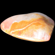 Calcite dyed hand-carved heart 61*58*16mm 85.5g in sunlight - Rocks and Things Store