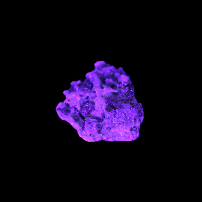 Tiny Spessartine Garnet cluster in UV light