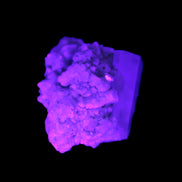 Blue Terminated Aquamarine crystal 21mm on Feldspar & Mica  in UV light