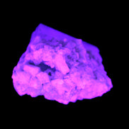 Blue Terminated Aquamarine crystal 21mm on Feldspar & Mica  in UV light