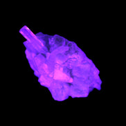 Thin Clear Aquamarine with tiny Lemurian Quartz crystals in UV light