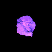 Tiny Green twinned Aquamarine crystal on matrix in UV light