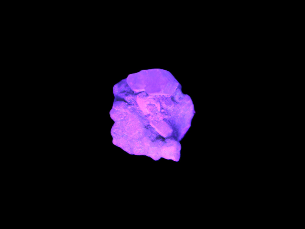 Tiny Green twinned Aquamarine crystal on matrix in UV light
