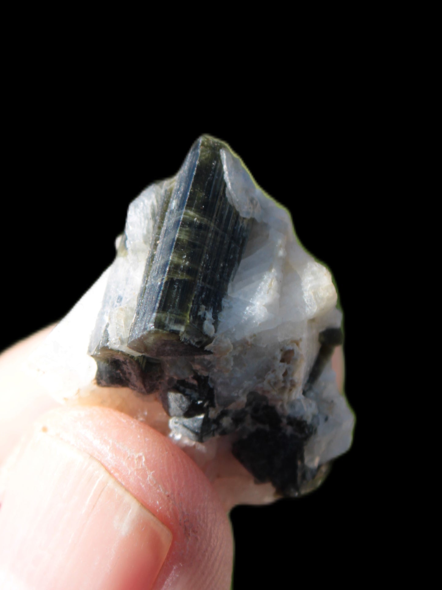 Black Elbaite cluster in matrix in sunshine