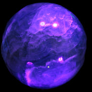 Large Green Fluorite sphere 2563g in UV light