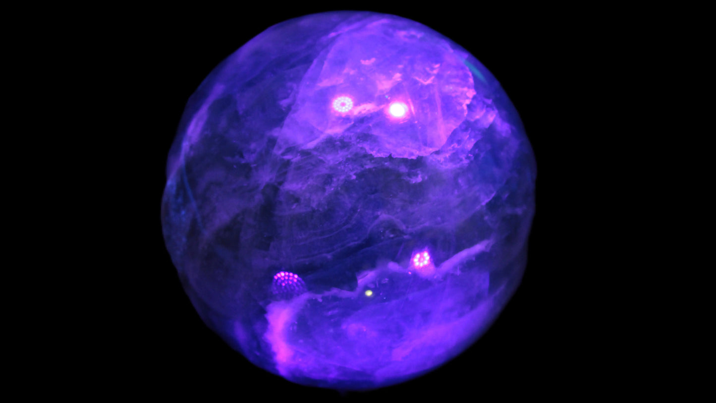 Large Green Fluorite sphere 2563g in UV light