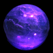 Large Green Fluorite sphere 2563g in UV light