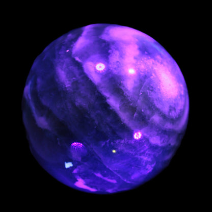 Large Green Fluorite sphere 2563g in UV light