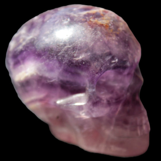 Purple Fluorite skull 50*34*49mm 108g in sunlight - Rocks and Things Store