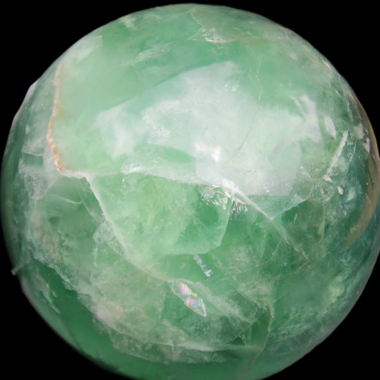 Rainbows Green Fluorite sphere 120mm 3350g in sunlight - Rocks and Things Store