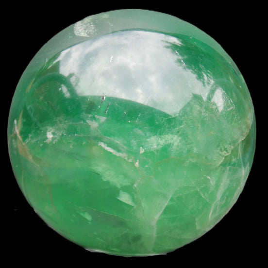 Rainbows Green Fluorite sphere 120mm 3350g in sunlight - Rocks and Things Store