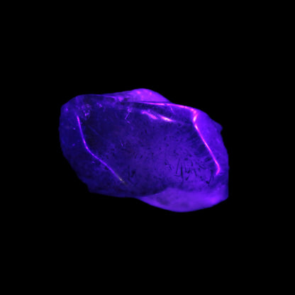 Super Seven Amethyst polished crystal 7g Rocks and Things Store in UV light