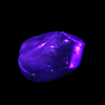 Super Seven Amethyst polished crystal 7g  Rocks and Things Store in UV light