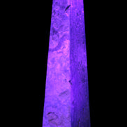Caribbean Calcite obelisk 263*54*56mm 1271g in UV light - Rocks and Things Store