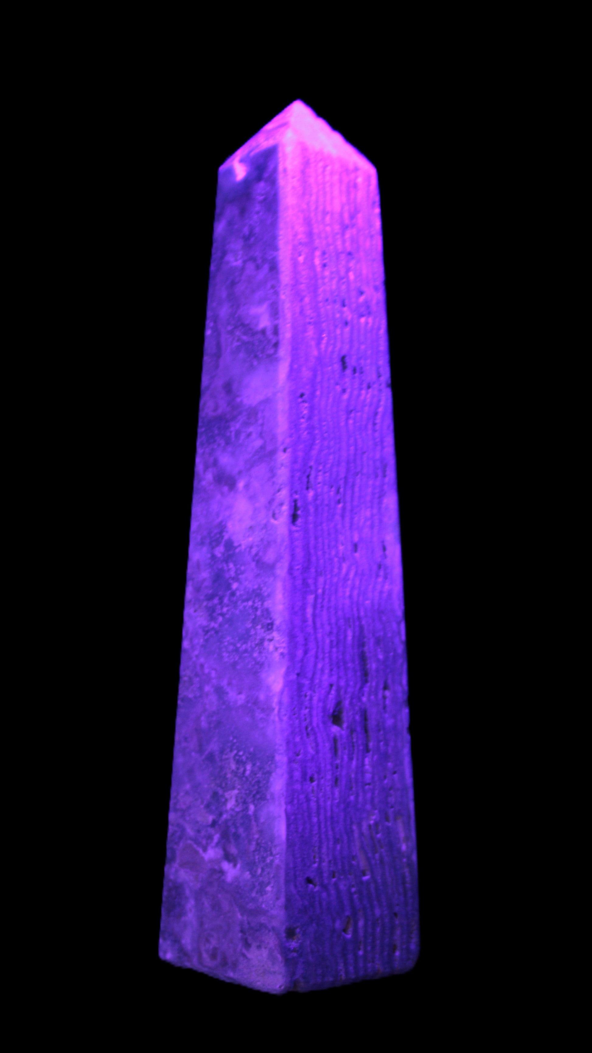 Caribbean Calcite obelisk 263*54*56mm 1271g in UV light - Rocks and Things Store