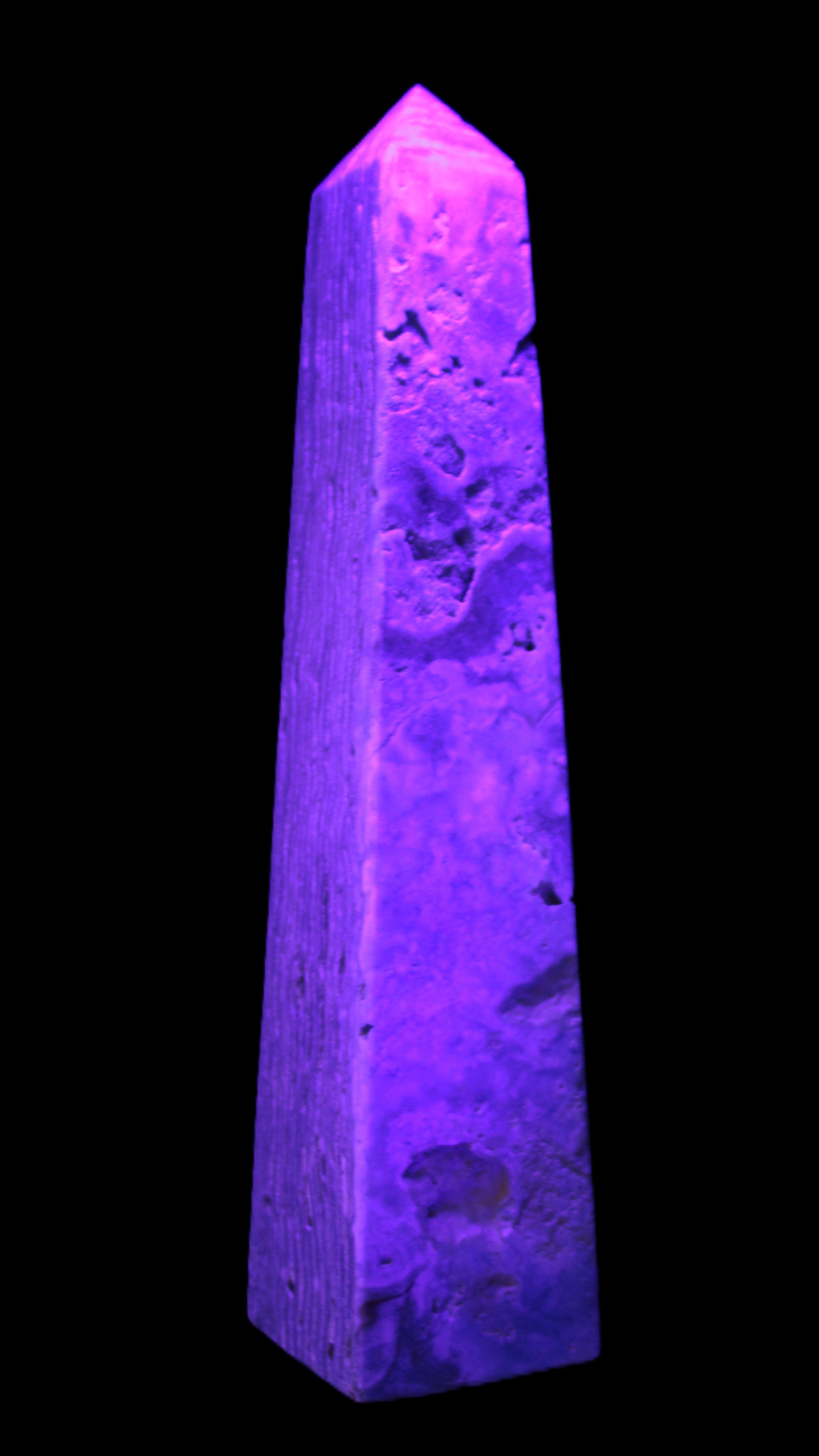 Caribbean Calcite obelisk 263*54*56mm 1271g in UV light - Rocks and Things Store