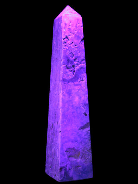Caribbean Calcite obelisk 263*54*56mm 1271g in UV light - Rocks and Things Store
