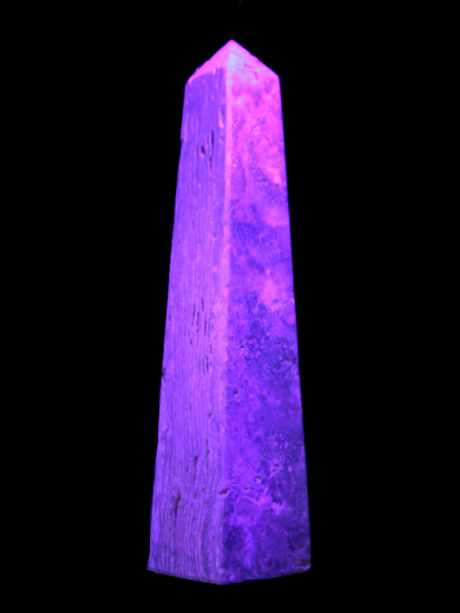 Caribbean Calcite obelisk 263*54*56mm 1271g in UV light - Rocks and Things Store
