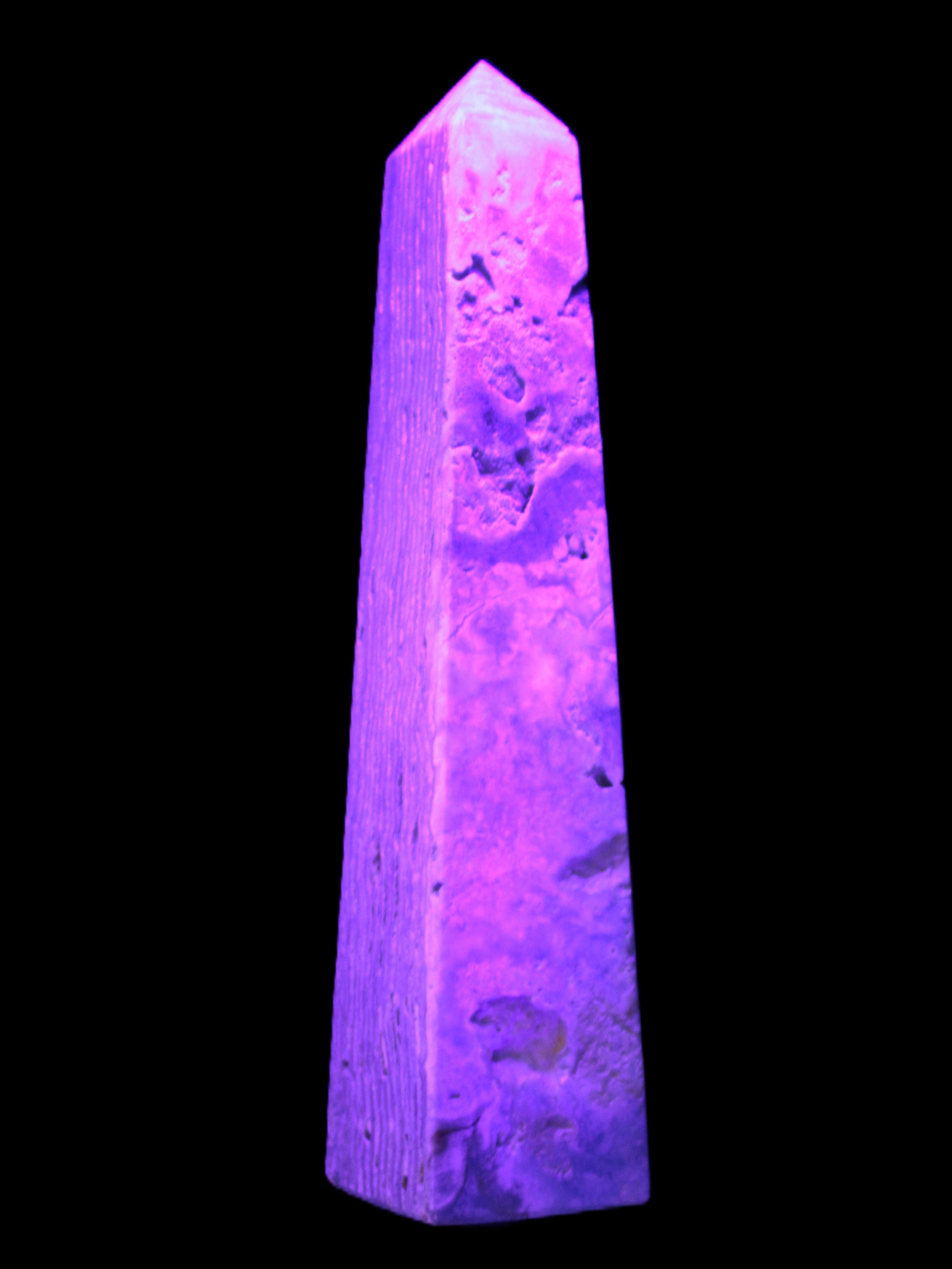 Caribbean Calcite obelisk 263*54*56mm 1271g in UV light - Rocks and Things Store