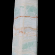 Pistachio Calcite obelisk 131*37*30mm 324g in sunlight - Rocks and Things Store