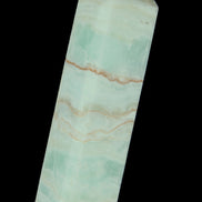 Pistachio Calcite obelisk 131*37*30mm 324g in sunlight - Rocks and Things Store