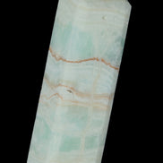 Pistachio Calcite obelisk 131*37*30mm 324g in sunlight - Rocks and Things Store