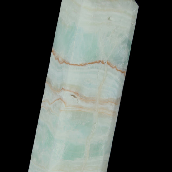 Pistachio Calcite obelisk 131*37*30mm 324g in sunlight - Rocks and Things Store